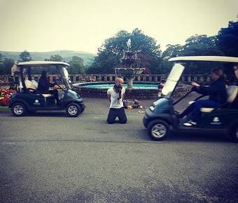 Cart in mouth ... Drummond on his knees near buggies before stunt.jpg